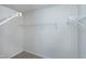 Walk-in closet with built-in shelving and carpet at 628 Denhoff Dr, Cary, NC 27519