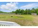 Expansive backyard with lush green grass, wooden fence, and ample space for outdoor activities at 71 Havistock Ct, Cameron, NC 28326