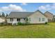 View of the backyard from the house, showcasing a small deck and well-maintained exterior at 71 Havistock Ct, Cameron, NC 28326