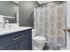 Bathroom with vanity sink and shower with patterned curtain at 71 Havistock Ct, Cameron, NC 28326