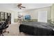 Bedroom featuring a large bed, ceiling fan, and neutral carpeting at 71 Havistock Ct, Cameron, NC 28326