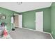 A comfy bedroom featuring green walls, gray carpet, and closet at 71 Havistock Ct, Cameron, NC 28326