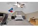A large bonus room featuring a fan, furniture, and a bright window for natural light at 71 Havistock Ct, Cameron, NC 28326