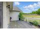 An outdoor wooden deck featuring views of the backyard and mature trees at 71 Havistock Ct, Cameron, NC 28326