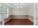 An empty dining room with hardwood floors and a chandelier at 71 Havistock Ct, Cameron, NC 28326