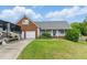 Charming home with a brick and vinyl exterior, attached garage, and a well-maintained lawn at 71 Havistock Ct, Cameron, NC 28326
