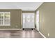 Spacious foyer with modern floors, a front door with glass, and neutral paint at 71 Havistock Ct, Cameron, NC 28326