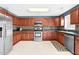 Updated kitchen boasts stainless steel appliances and dark countertops at 71 Havistock Ct, Cameron, NC 28326