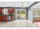 Eat-in kitchen features stainless steel appliances, dark countertops, and backyard access at 71 Havistock Ct, Cameron, NC 28326