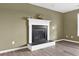Close-up of a gas fireplace with decorative mantle and hearth in the living room at 71 Havistock Ct, Cameron, NC 28326