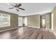 Open living room with neutral paint, wood-look floors, and lots of natural light at 71 Havistock Ct, Cameron, NC 28326