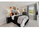 A teenager's bedroom includes a unique basketball decor theme and a comfortable black and gray bed at 711 Chandler Stone Dr, Zebulon, NC 27597