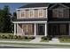 Charming two-story townhome featuring a covered porch, painted siding, and manicured landscaping at 711 Chandler Stone Dr, Zebulon, NC 27597