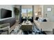 Comfortable living room with large windows, a plush sofa, and stylish accents at 711 Chandler Stone Dr, Zebulon, NC 27597