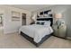 Spacious main bedroom with calming colors, ample natural light, and elegant furnishings at 711 Chandler Stone Dr, Zebulon, NC 27597