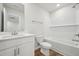 Bathroom featuring a tub with tile surround, modern fixtures, and vanity at 713 Chandler Stone Dr, Zebulon, NC 27597