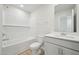 Clean, bright bathroom with tub shower, white subway tiles, and white vanity sink at 715 Chandler Stone Dr, Zebulon, NC 27597