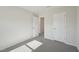 Cozy bedroom has plush carpet, closet space, and a connecting door at 715 Chandler Stone Dr, Zebulon, NC 27597