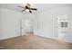 Large bedroom with neutral carpet and open entry to the bathroom at 802 Windermere Lake Ct, Apex, NC 27502