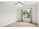Carpeted bedroom featuring neutral colors and a large bright window at 802 Windermere Lake Ct, Apex, NC 27502