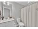 Clean, well-lit bathroom features white cabinets, quartz countertops, and modern fixtures at 9 Little Sunshine Brk, Smithfield, NC 27577