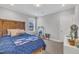 Cozy bedroom with a wood headboard bed, window, carpet flooring, and bright neutral walls at 9 Little Sunshine Brk, Smithfield, NC 27577