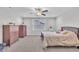 Inviting bedroom with neutral walls, carpet, ceiling fan, and an abundance of natural light at 9 Little Sunshine Brk, Smithfield, NC 27577