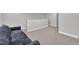 This bonus room features neutral walls, plush carpet, and white trim at 9 Little Sunshine Brk, Smithfield, NC 27577