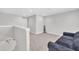 Neutral bonus room with a comfortable sofa, and access to another room at 9 Little Sunshine Brk, Smithfield, NC 27577