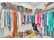 Well-organized closet featuring rods and shelves for clothing storage at 9 Little Sunshine Brk, Smithfield, NC 27577