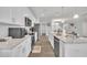 Bright kitchen boasts white cabinets, granite countertops, and stainless steel appliances at 9 Little Sunshine Brk, Smithfield, NC 27577