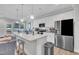 Kitchen island features granite countertops, a sink, and stainless steel appliances at 9 Little Sunshine Brk, Smithfield, NC 27577