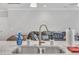 Kitchen island features granite countertops, a sink, and stainless steel faucet at 9 Little Sunshine Brk, Smithfield, NC 27577
