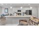 Kitchen island features granite countertops, a sink, and white cabinets at 9 Little Sunshine Brk, Smithfield, NC 27577