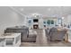 Comfortable living room featuring a ceiling fan, fireplace, and access to a back patio at 9 Little Sunshine Brk, Smithfield, NC 27577