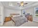 Bright bedroom has lots of natural light with windows, a ceiling fan, and neutral decor at 9 Little Sunshine Brk, Smithfield, NC 27577