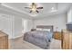 Main bedroom features tray ceilings, carpet floors, and a ceiling fan at 9 Little Sunshine Brk, Smithfield, NC 27577