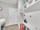 Mud room includes a bench with storage, coat hooks, and a door to the garage at 9 Little Sunshine Brk, Smithfield, NC 27577