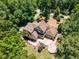Expansive backyard features stone patio, and lush trees surrounding the two-story home at 90021 Hoey, Chapel Hill, NC 27517