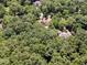 Aerial view showcasing a home nestled in a lush, wooded area, providing privacy and a serene setting at 90021 Hoey, Chapel Hill, NC 27517