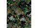 Aerial view of a wooded lot with defined property lines, surrounded by mature trees and homes, showcasing its natural setting at 90021 Hoey, Chapel Hill, NC 27517
