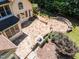 Aerial view of the backyard features a large patio with an outdoor grill at 90021 Hoey, Chapel Hill, NC 27517
