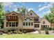 Large backyard features green grass and mature trees, with a second story deck at 90021 Hoey, Chapel Hill, NC 27517