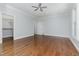 A bedroom features hardwood floors and a ceiling fan at 90021 Hoey, Chapel Hill, NC 27517
