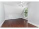 Large bonus room featuring hardwood floors, ceiling fan and a large arched window at 90021 Hoey, Chapel Hill, NC 27517