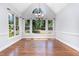 Spacious dining area with hardwood floors, large windows, and modern lighting at 90021 Hoey, Chapel Hill, NC 27517