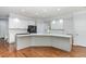 Modern kitchen with white cabinets, sleek countertops, and stainless steel appliances at 90021 Hoey, Chapel Hill, NC 27517