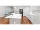 Gourmet kitchen featuring quartz countertops, stainless steel appliances, and custom cabinetry at 90021 Hoey, Chapel Hill, NC 27517