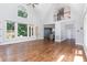 Open-concept living room with high ceilings, hardwood floors, and ample natural light at 90021 Hoey, Chapel Hill, NC 27517