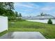 Backyard view highlighting the grassy area and privacy fence, creating a serene outdoor space at 905 Alice Ct, Haw River, NC 27258